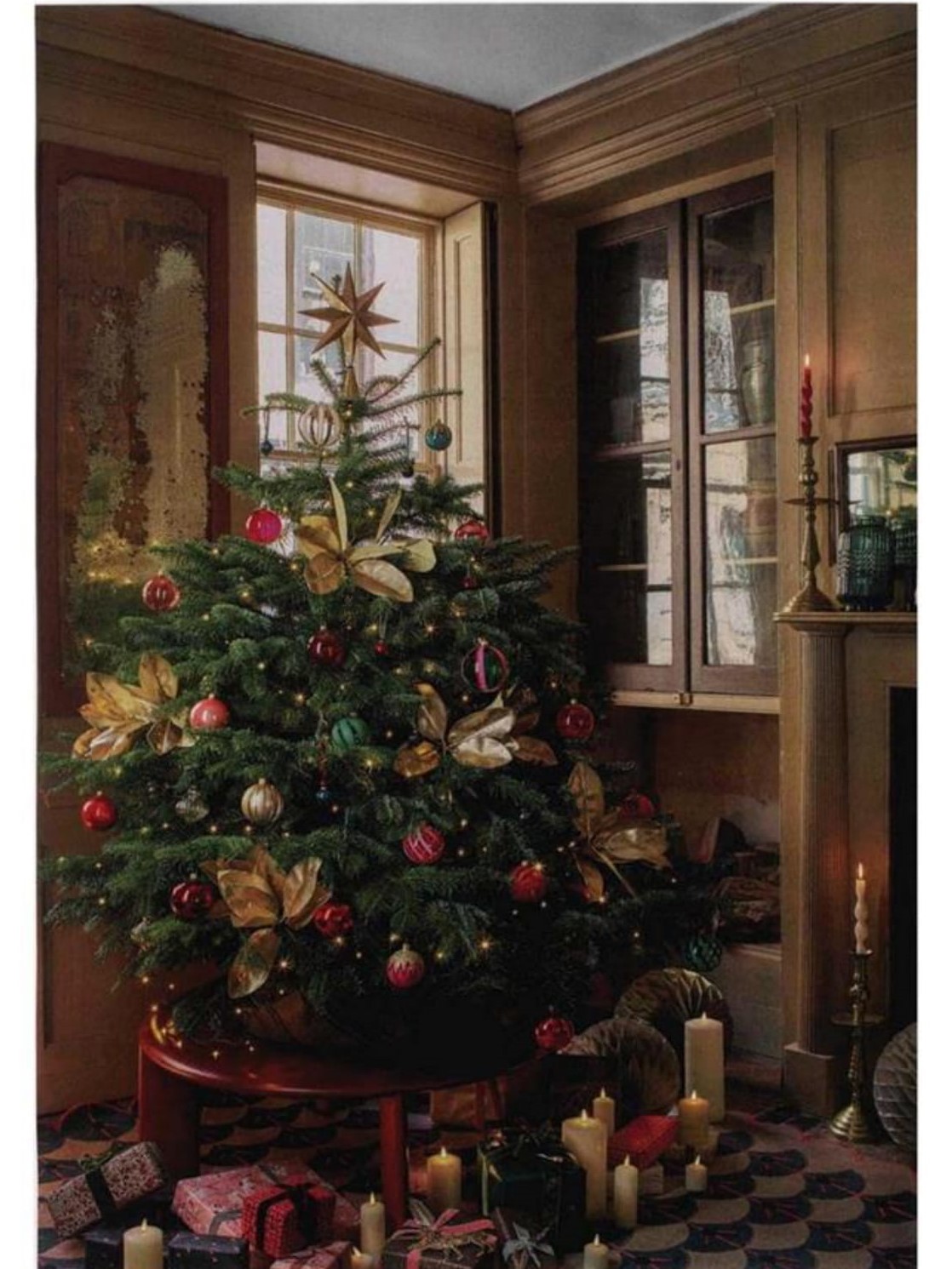 Living Etc putting their tree in the spotlight, perched on L.Ercolani's IO table in Vintage Red